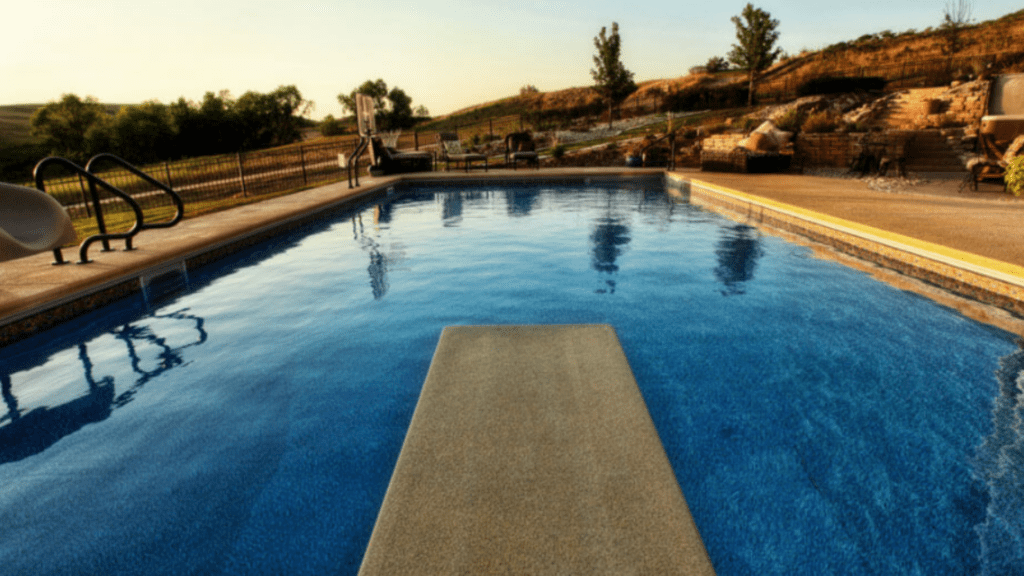Inground swimming pool with diving board