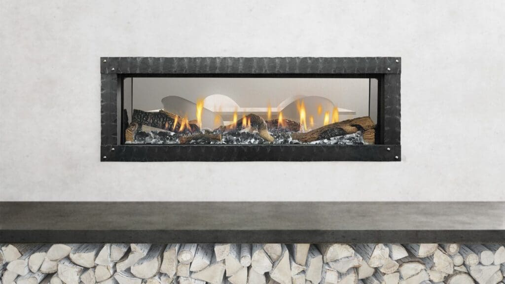 A lit gas fireplace between rooms
